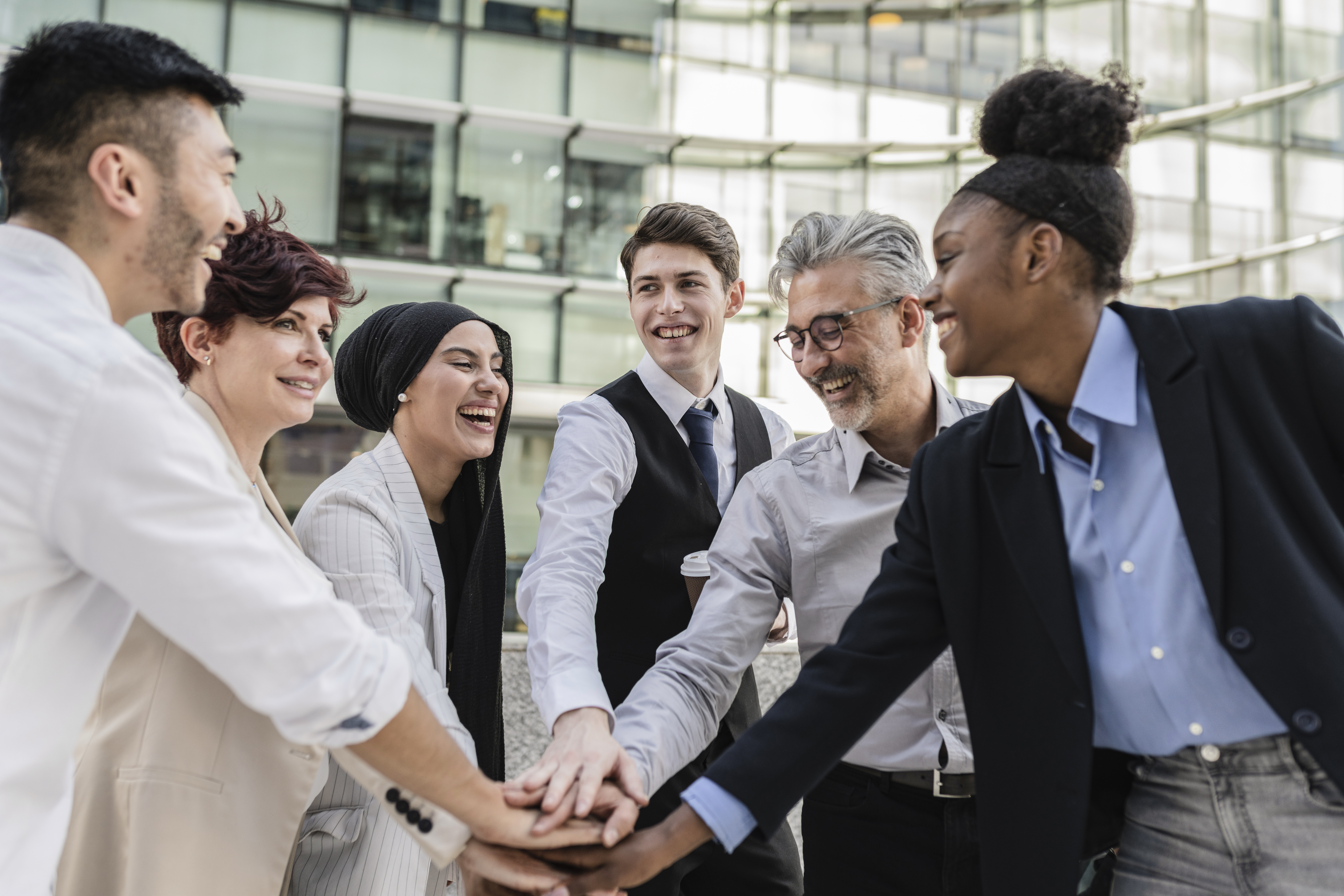 happy-professionals-with-hands-together-in-collabo-2026-01-09-06-24-05-utc